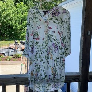 A white t-shirt dress with floral print.